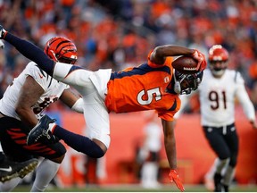 Denver Broncos quarterback Teddy Bridgewater dives with the football in the third quarter against the Cincinnati Bengals at Empower Field at Mile High.