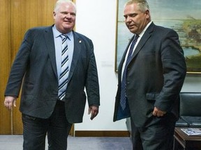 Then-Toronto mayor Rob Ford (left) and Doug Ford -- a city councillor at the time -- prepare to speak to the media at Toronto City Hall on Feb. 24, 2014