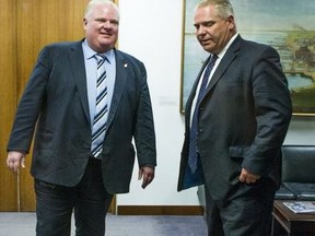 Then-Toronto mayor Rob Ford (left) and Doug Ford — a city councillor at the time — prepare to speak to the media at Toronto City Hall on Feb. 24, 2014