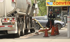 A tanker operator drops 24,000 litres from his truck into the tanks at the Pioneer station at Main St. and Gerrard St. E., on Thursday, June 30, 2022, just before the Canada Day long weekend when Ontario tax cuts would see the price drop six cents per litre with an additional five cents the following day.