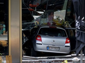 A car that crashed into a group of people and ended up in a storefront near Breitscheidplatz is pictured, in Berlin, Germany, June 8, 2022.