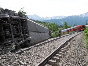This video grab taken from footage of Network Pictures on June 3, 2022 shows rescue services at the site of a derailed train near Burgrain near Garmisch-Partenkirchen, southern Germany.