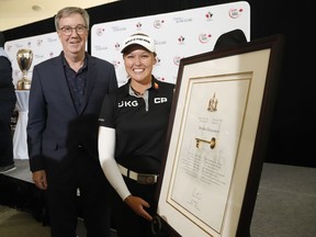 Canadian golfer Brooke Henderson receives the key to the city of Ottawa from Ottawa mayor Jim Watson at a press conference for the 2022 CP Women's Open golf tournament at the Ottawa Hunt Golf and Country Club on Tuesday, June 28, 2022.