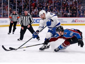 Tampa Bay Lightning defenseman Erik Cernak (81) and Colorado Avalanche right wing Mikko Rantanen (96) battle for the puck in the first period at the Pepsi Center.