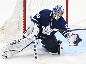 Toronto Maple Leafs goalie Jack Campbell (36) makes a glove save against the Tampa Bay Lightning in game seven of the first round of the 2022 Stanley Cup Playoffs at Scotiabank Arena.
