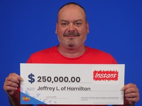 Hamilton's Jeffrey Leek with his big cheque.