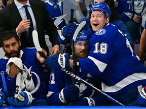 Steven Stamkos of the Tampa Bay Lightning celebrates on the bench with teammate Ondrej Palat after scoring during Game 6 of the Eastern Conference Final at Amalie Arena on June 11, 2022 in Tampa, Florida.