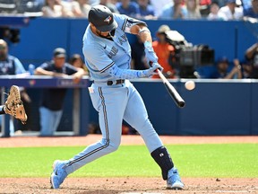 Toronto Blue Jays left fielder Lourdes Gurriel Jr. hits a grand slam home run against the New York Yankees in the sixth inning at Rogers Centre on June 19, 2022 in Toronto.