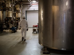 A Mars employee in Elizabethtown walks past equipment that is just one step in chocolate making.