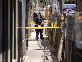 Toronto Police officers at the scene of a fatal shooting Sunday, June 5, 2022 on Eglinton Ave. W, near Oakwood Ave. Ernest Doroszuk/Toronto Sun