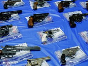 Guns are displayed after a buyback event organized by the New York City Police Department June 12, 2021.