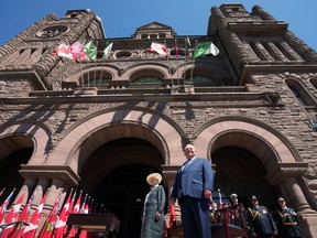 Lieutenant-Governor of Ontario Elizabeth Dowdeswell stands with Premier Doug Ford prior to the announcement of his new cabinet at the swearing-in ceremony at Queen's Park in Toronto on June 24, 2022. Ontario legislators will return to provincial parliament on Aug. 8. Premier Doug Ford says the legislature will sit for approximately five weeks starting on that day.