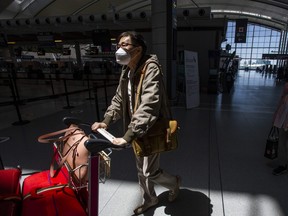 Travellers are pictued at the departures level at Toronto Pearson International Airport on June 14, 2022.