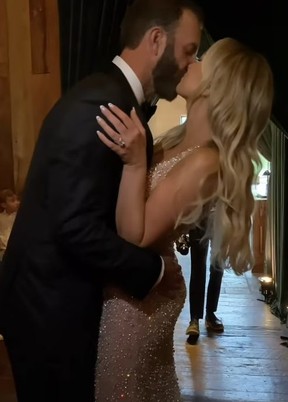 WEDDING DAY SMOOCH! Paulina Gretzky and Dustin Johnson. PAULINA GRETZKY/ INSTAGRAM