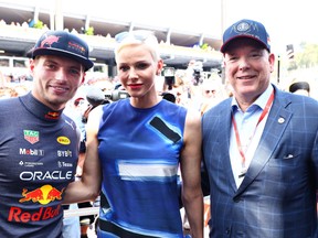 Max Verstappen of the Netherlands and Oracle Red Bull Racing, Princess Charlene of Monaco and Prince Albert of Monaco pose for a photo prior to qualifying ahead of the F1 Grand Prix of Monaco at Circuit de Monaco on May 28, 2022 in Monte-Carlo, Monaco.