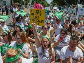 Abortion rights activists block an intersection near the United States Supreme Court to protest the court's ruling to overturn the landmark Roe v Wade abortion decision, in Washington, U.S., June 30, 2022.