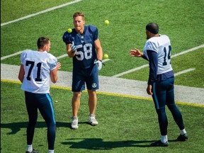 Argos' long-snapper Jake Reinhart (middle) does some tennis ball co-ordination drills with placekicker Boris Bede (right) and punter John Haggerty during training camp at Guelph yesterday.