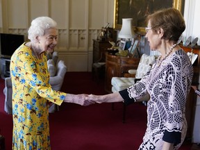 Queen Elizabeth greets New South Wales governor Margaret Beazley at Windsor Castle on June 22, 2022.