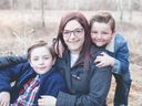 Jennifer Henson and her sons Kayden, left, and Chase are seen in Calgary in this undated handout image provided June 22, 2022. 