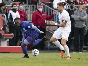May 28, 2022; Toronto, Ontario, CAN; Chicago Fire defender Rafael Czichos (5) battles for the ball against Toronto FC forward Ayo Akinola (20) during the first half at BMO Field.