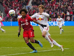 Mar 5, 2022; Toronto, Ontario, CAN; Toronto FC forward Jahkeele Marshall-Rutty (7) and New York Red Bulls forward Tom Barlow (74) chase after a ball at BMO Field.