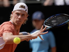 Denis Shapovalov returns the ball to Lorenzo Sonego during their match at the Italian Open tennis tournament, in Rome, Monday, May 9, 2022.