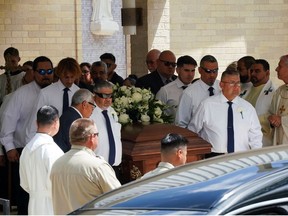 Pallbearers carry a coffin during a joint funeral service for teacher Irma Garcia, one of the victims of the Robb Elementary School mass shooting, and her husband Joe Garcia who died suddenly two days later in Uvalde, Texas, U.S. June 1, 2022.