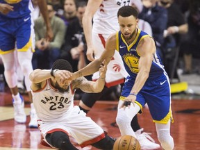 Fred Vanvleet gets fouled by Steph Curry in action in 2nd quarter action as the Toronto Raptors lead the Golden State Warriors in Game 1 of the NBA Finals in Toronto. on Friday May 31, 2019.