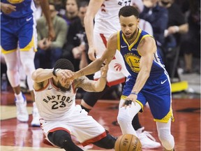 Fred Vanvleet gets fouled by Steph Curry in action in 2nd quarter action as the Toronto Raptors lead the Golden State Warriors in Game 1 of the NBA Finals in Toronto. on Friday May 31, 2019.