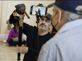 Actor and comedian Robert Smigel performs as Triumph the Insult Comic Dog in the hallways outside the House Select Committee to Investigate the January 6th Attack on the U.S. Capitol hearing in the Cannon House Office Building on June 16, 2022 in Washington, D.C.