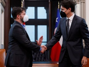 Prime Minister Justin Trudeau greets Chile's President Gabriel Boric in his office on Parliament Hill in Ottawa on June 6, 2022.