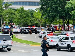 In this handout photo courtesy of Tulsa Police Department taken on June 1, 2022, police officers respond to a call about a man armed with a rifle at the Natalie Building at St. Francis Hospital in Tulsa, Okla.