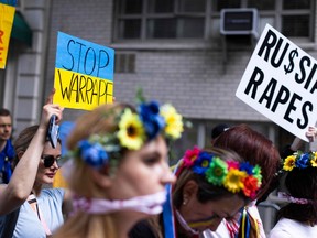 In this file photo taken on May 28, 2022, activists protest rape during war and gather to support Ukraine in front of the Russian Consulate in New York.