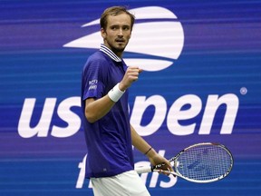FILE - Daniil Medvedev, of Russia, reacts after scoring a point against Novak Djokovic, of Serbia, during the men's singles final of the U.S. Open tennis championships, Sunday, Sept. 12, 2021, in New York. The U.S. Open tennis tournament will allow players from Russia and Belarus to compete this year despite the ongoing invasion of Ukraine that prompted a ban at Wimbledon.