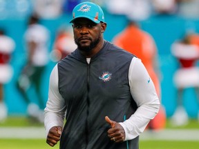 Miami Gardens, Florida, USA; Miami Dolphins head coach Brian Flores runs off the field after winning the game against the New York Jets at Hard Rock Stadium.