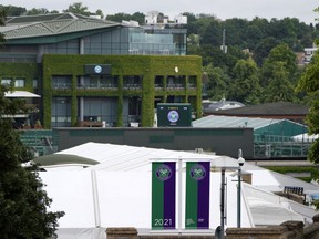This June 25, 2021 photo shows the All England Lawn Tennis Club in London. Wimbledon will offer a record total of 40.3 million pounds ($50.5 million) in player compensation this year, but the singles champions will receive less than the pre-pandemic amount. The prize money excluding per diems totals a record 38.9 million pounds ($48.8 million), the All England Club announced Thursday, June 9, 2022.