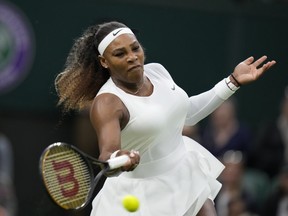 Serena Williams plays a return to Aliaksandra Sasnovich in a first-round match during the Wimbledon Tennis Championships in London, Tuesday June 29, 2021.