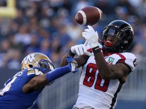 CFL Winnipeg Blue Bombers Marcus Sayles (14) in game action with Ottawa Redblacks Caleb Holley (80) in Winnipeg. Friday, July 19/2019.
