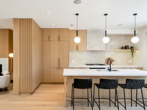 This project by MGB Construction Group Ltd. won the 2022 BILD Renovation Award for Best Kitchen Renovation over $100,000. ROBERT HOLOWKA | BIRD HOUSE MEDIA