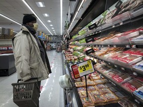 A man shops in the meat section at a grocery store, April 28, 2020 Washington, DC.