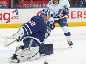 Jack Campbell #36 of the Toronto Maple Leafs makes a save with Brayden Point #21 of the Tampa Bay Lightning on his doorstep during Game Five of the First Round of the 2022 Stanley Cup Playoffs at Scotiabank Arena on May 10, 2022 in Toronto, Ontario, Canada.