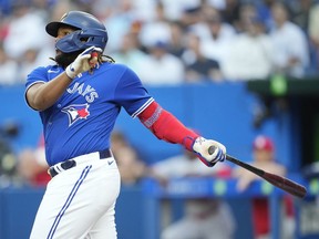Vladimir Guerrero Jr. of the Toronto Blue Jays hits a home run against the St. Louis Cardinals in the first inning during their MLB game at Rogers Center on July 26, 2022 in Toronto, Ontario, Canada.