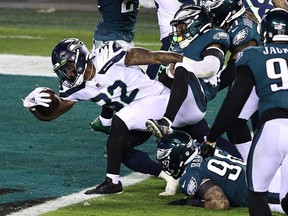 Chris Carson #32 of the Seattle Seahawks scores a touchdown against Rodney McLeod #23 of the Philadelphia Eagles during the second quarter at Lincoln Financial Field on November 30, 2020 in Philadelphia, Pennsylvania.