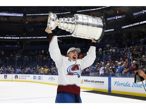 Nicolas Aube-Kubel #16 of the Colorado Avalanche lifts the Stanley Cup after defeating the Tampa Bay Lightning 2-1 in Game Six of the 2022 NHL Stanley Cup Final at Amalie Arena on June 26, 2022 in Tampa, Florida.