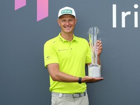 Adrian Meronk of Poland poses with the trophy after securing victory during Day Four of the Horizon Irish Open at Mount Juliet Estate on July 3, 2022 in Thomastown, Ireland.