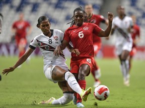 Deanne Rose of Canada, right, fights for the ball with Victoria Swift of Trinidad and Tobago during the match between Canada and Trinidad & Tobago as part of the 2022 Concacaf W Championship at BBVA Stadium on July 05, 2022 in Monterrey, Mexico.