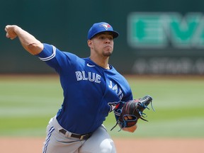 Jose Berrios #17 of the Toronto Blue Jays pitches in the bottom of the first inning against the Oakland Athletics at RingCentral Coliseum on July 6, 2022 in Oakland, California. (Photo by Lachlan Cunningham/Getty Images)