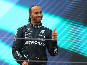 Third placed Lewis Hamilton of Great Britain and Mercedes celebrates on the podium during the F1 Grand Prix of Austria at Red Bull Ring on July 10, 2022 in Spielberg, Austria.