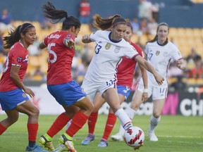 Alex Morgan of USA fights for the ball with Cristin Granados of Costa Rica during the semifinal between United States and Costa Rica as part of the 2022 Concacaf W Championship at Universitario Stadium on July 14, 2022 in Monterrey, Mexico.