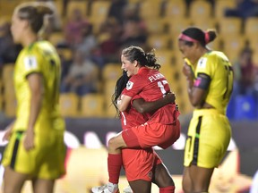 Jessie Fleming of Canada celebrates with teammates after scoring her team's first goal during the semifinal between Canada and Jamaica as part of the 2022 Concacaf W Championship at Universitario Stadium on July 14, 2022 in Monterrey, Mexico.
